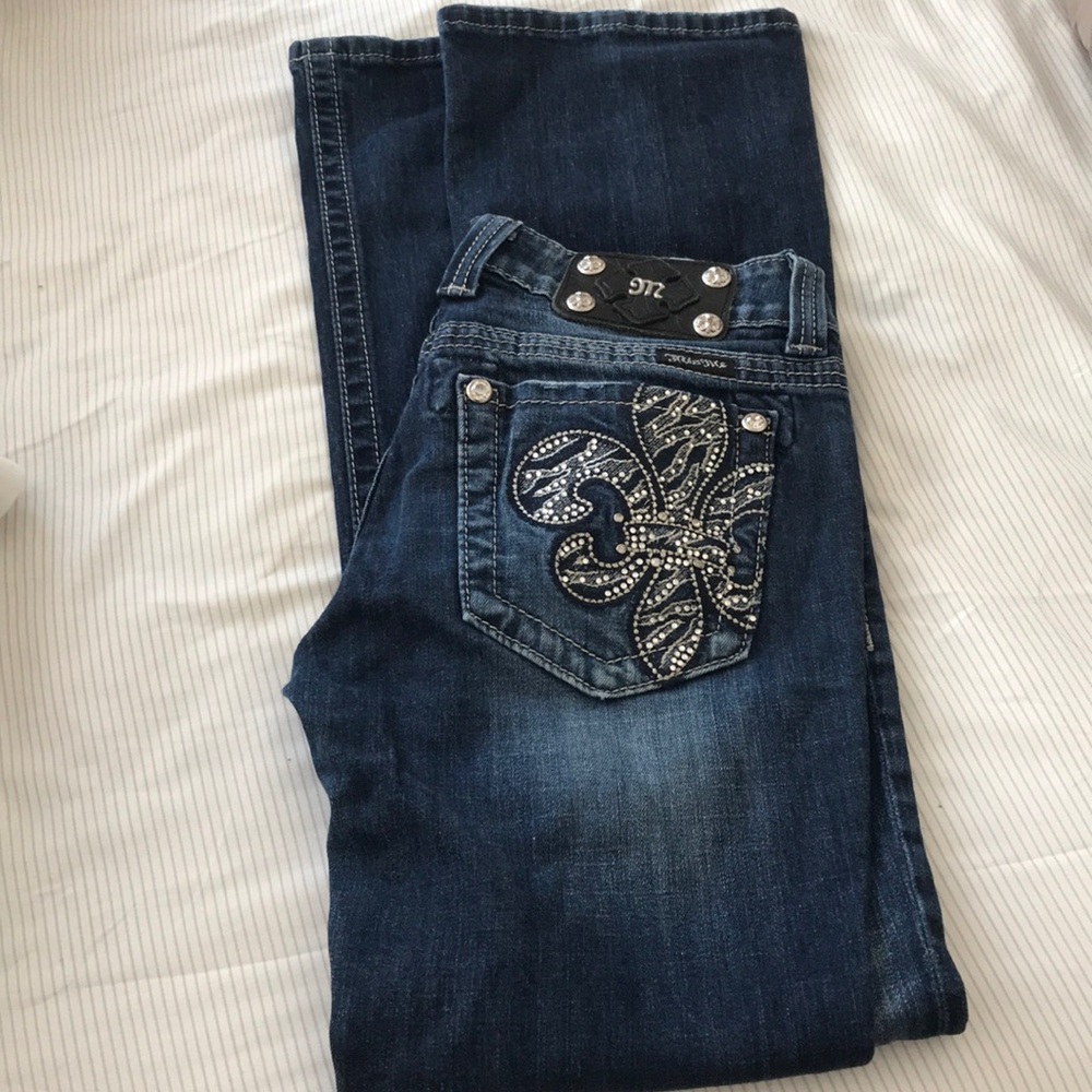 Size 28 Miss Me fleur de lis jeans. Boot cut.